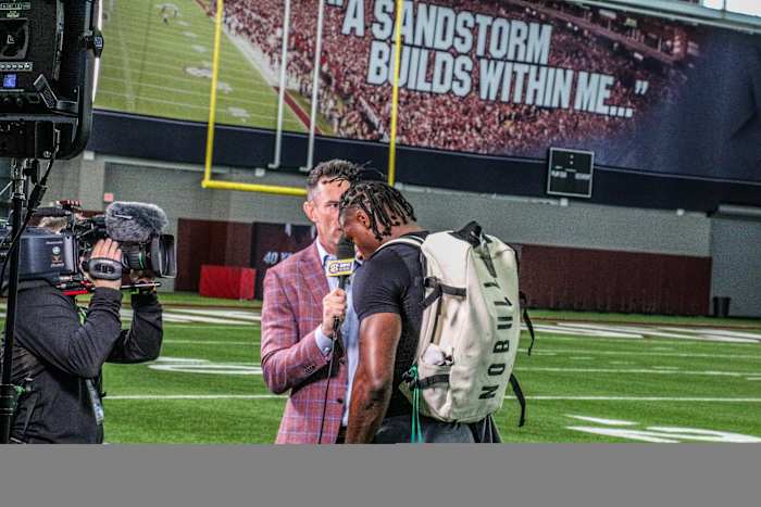 SEC Network's Peter Burns talks to WR Xavier Legette after his workout